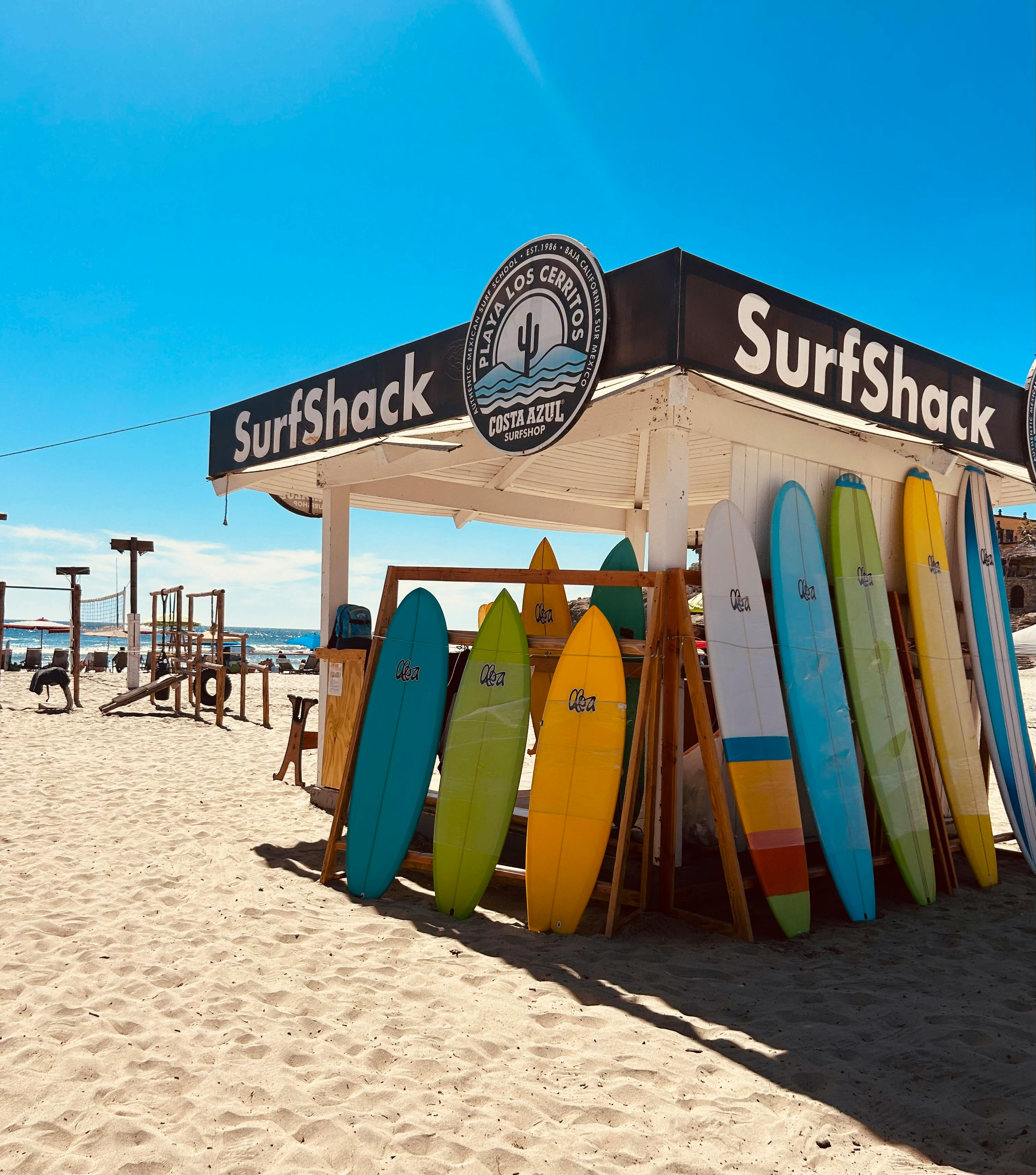 Surfboards lined up at a shack